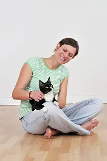Owners: Cat - sitting on owners lap being stroked