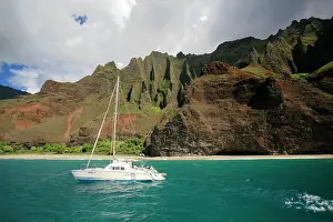 230518: Catamaran sailing boat in front of the steep cliffs