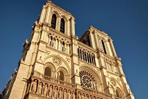 Parisian: Cathedral Notre Dame bathed in setting sunlight