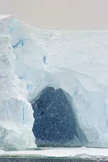Heavy: Cave in Iceberg with heavy snowfall