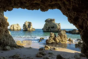 Praia: Cave at Praia dos Arrifes, rocks and sea in the