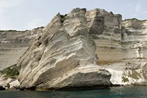 Swimmers: Chalk cliffs by sea - with swimmers