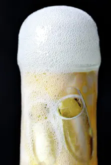 Opened: Champagne bottle foaming over, artificial carbon