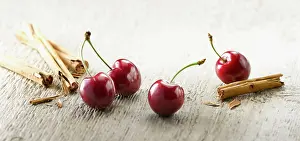 Cherries: Cherry, Prunus cultivar. Four cherries with stalks
