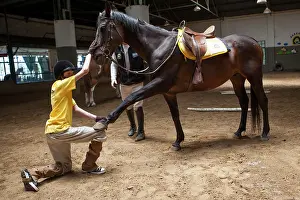 Trust: Child doing an exercise in trust with a horse