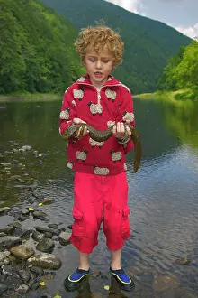 Hellbenders: Child holding Hellbender