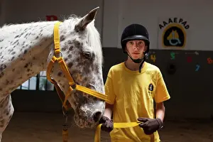 Halter: Child and horse in a horse therapy center - Argentina