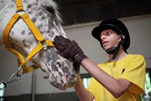 Halter: Child and horse in a horse therapy center - Argentina
