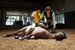 Speaking: Child making a trust exercise on a horse in horse therapy