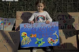 Plastic: Child on student climate change strike holding a