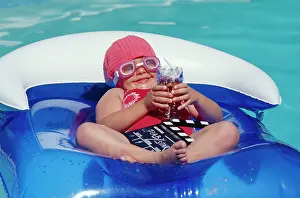 Glamour: Child - water baby in lilo