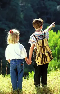Backview: Children - backview of boy and girl holding hands