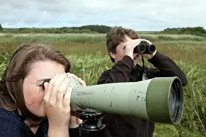 Binoculars: Children birdwatching - looking through telescope