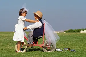 Bikes: CHILDREN - cute boy & girl on bike