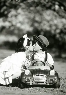 Glamour: Children - kiss in toy car