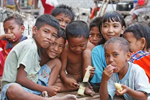 Canes: Children in Komodo Village - eating sugar cane