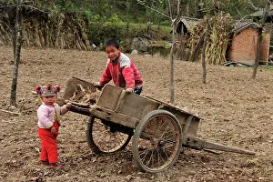 Cart: Children - playing with hand wheelbarrow