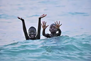 Waving: Children swimming