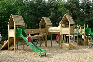 Exercising: Children's adventure playground. Child on slide