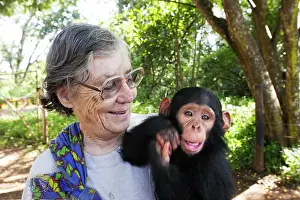 Sheila: Chimfushi Chimpanzee Ophanage - Sheila Siddle holding