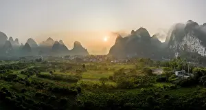 Guilin: Chinese karst mountains near Yangshuo at sunrise