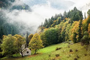 Fribourg: Church in fog in the H&, x1acb25;ntal valley, autumn