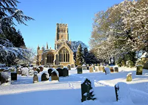 Cemeteries: Church - and graveyard in winter snow