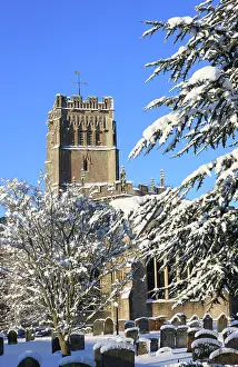 Cemeteries: Church - and graveyard in winter snow