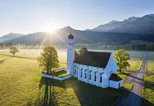 Reflex: Church St. Coloman at sunrise, near Schwangau, drone