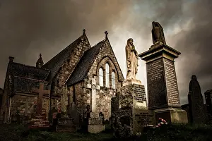 Glen: Church St. John with cemetery under dramatic sky