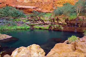 Heavily: Circular Pool - water cascades down a steep, heavily