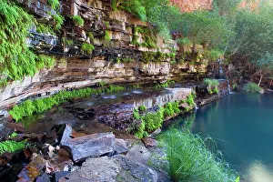 Heavily: Circular Pool - water cascades down a steep, heavily