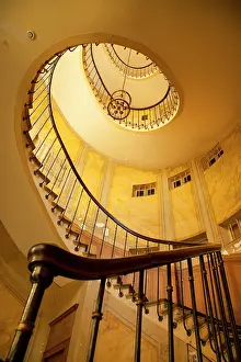 Step: Circular staircase inside building near
