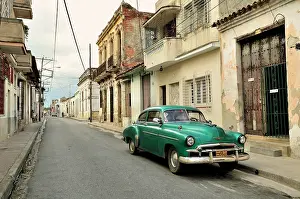 Avenues: Classic car in the historic district of Camaguey