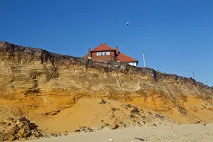 Victim: Cliff Erosion - this house will soon fall victim to erosion