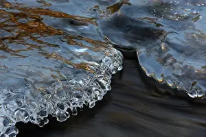 Formed: Close up of an Ice formation formed in a small stream with r