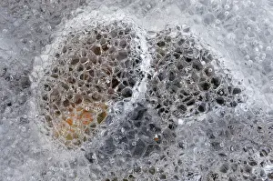 Vesturland: Close up of small pebbles frozen in ice