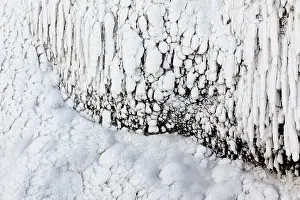Skogafoss: Close up of snow-covered icicles