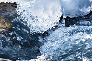 Splash: Closeup of ice in the water of a flowing river