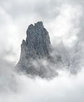 Odle: Cloud-covered rocky peaks, mountain peaks of the
