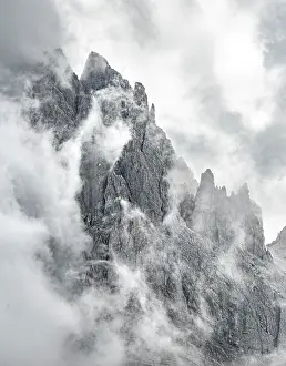 Odle: Cloud-covered rocky peaks, mountain peaks of the