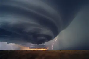 Severe: A cloud-to-cloud lightning bolt ejects from an isolated