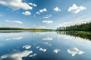 Kainuu: Clouds, forest, trees reflected in the lake, Hossa