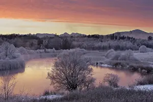 Daybreak: The clouds illuminated red by the sunrise are re