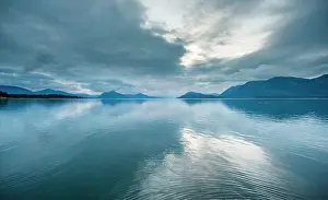 Fjords: Clouds are reflected in water in the fjords of A