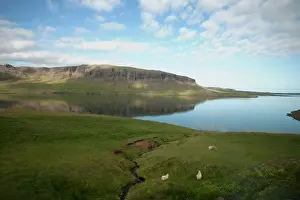 Bartruff: Clouds reflected on waters of calm glacial