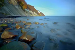 Shutter: Coastal landscape showing stones in the sea with chalk cliff