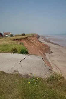 Collapsed: Collapsed tarmac road following cliff erosion on coast