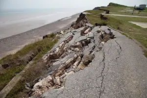 Collapsed: Collapsed tarmac road following cliff erosion on coast
