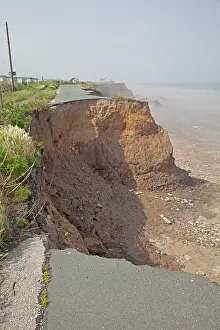 Collapsing: Collapsing tarmac road at cliff edge on coast road